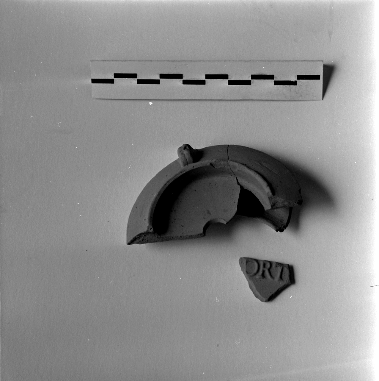 lucerna, Buchi X a (fine/ fine secc. I - II d.C)