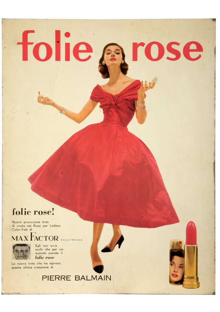 figura femminile in elegante abito rosso con un rossetto e uno specchietto (locandina) - ambito statunitense (sec. XX)