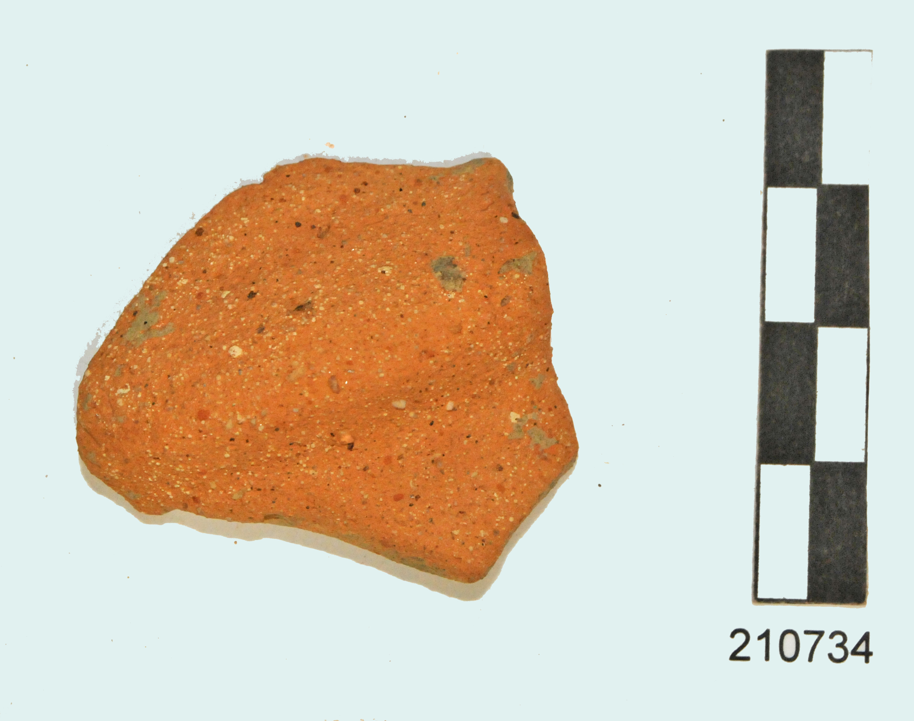 vasetto, biansato/ parete, argilla dura, poco depurata, Munsell 7.5YR7/6 reddish yellow (I d.C - II d.C)