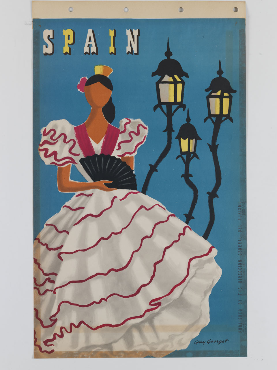 donna in abito tradizionale spagnolo con ventaglio affiancata da tre lampioni (manifesto) di Georget Guy (sec. XX)