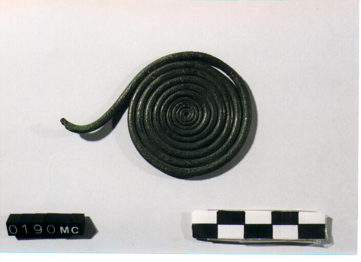 FIBULA A QUATTRO SPIRALI/ FRAMMENTO - CULTURA TOMBE A FOSSA (Prima metà SEC. VIII A.C)