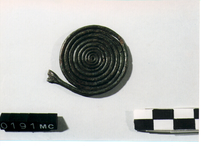 FIBULA A QUATTRO SPIRALI/ FRAMMENTO - CULTURA TOMBE A FOSSA (Prima metà SEC. VIII A.C)