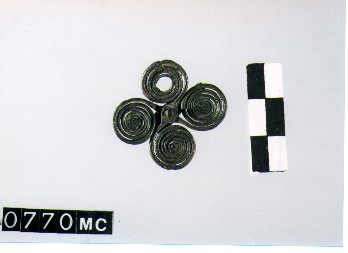 FIBULA A QUATTRO SPIRALI - CULTURA TOMBE A FOSSA (SECC. IX/VIII A.C)