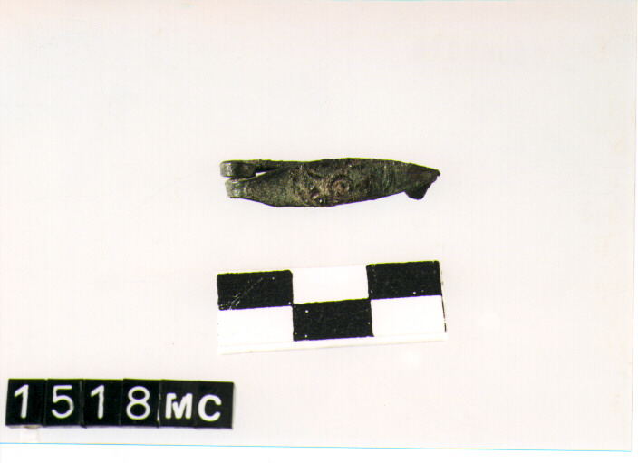 FIBULA CON ARCO A NASTRO - CULTURA TOMBE A FOSSA (SEC. VIII A.C)