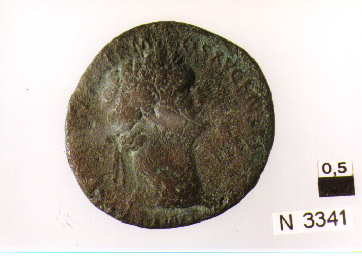 R/ testa laureata di Domiziano a destra; V/ Roma stante a destra in abitimilitari con lancia e parazomium (moneta, asse) (sec. I d.C)