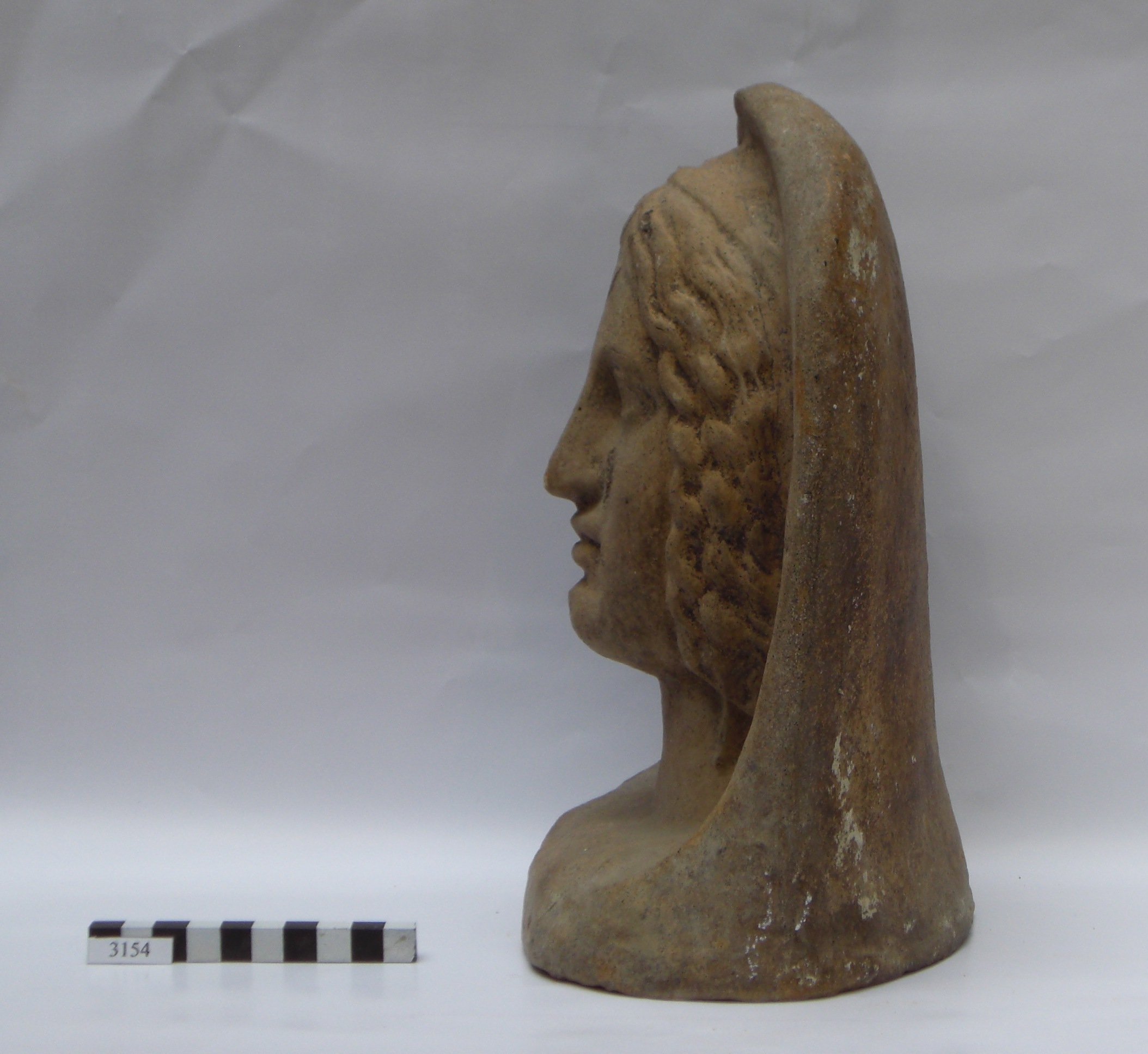 figura femminile (testa votiva) - età medio repubblicana (fine/inizio secc. III-II a.C) 