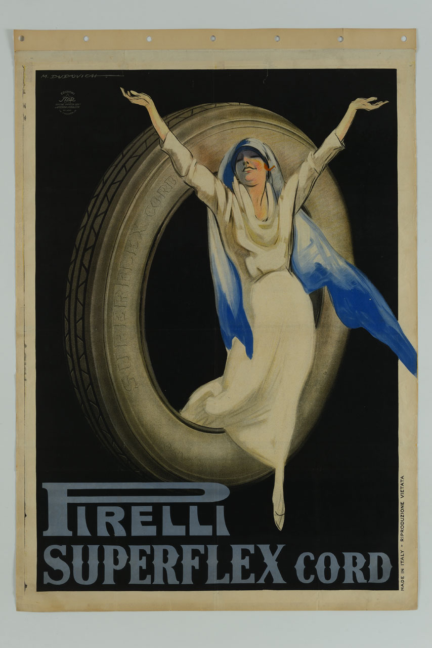 donna sorridente con velo azzurro sul capo esce da un grande pneumatico con le braccia spalancate (manifesto) di Dudovich Marcello (sec. XX)
