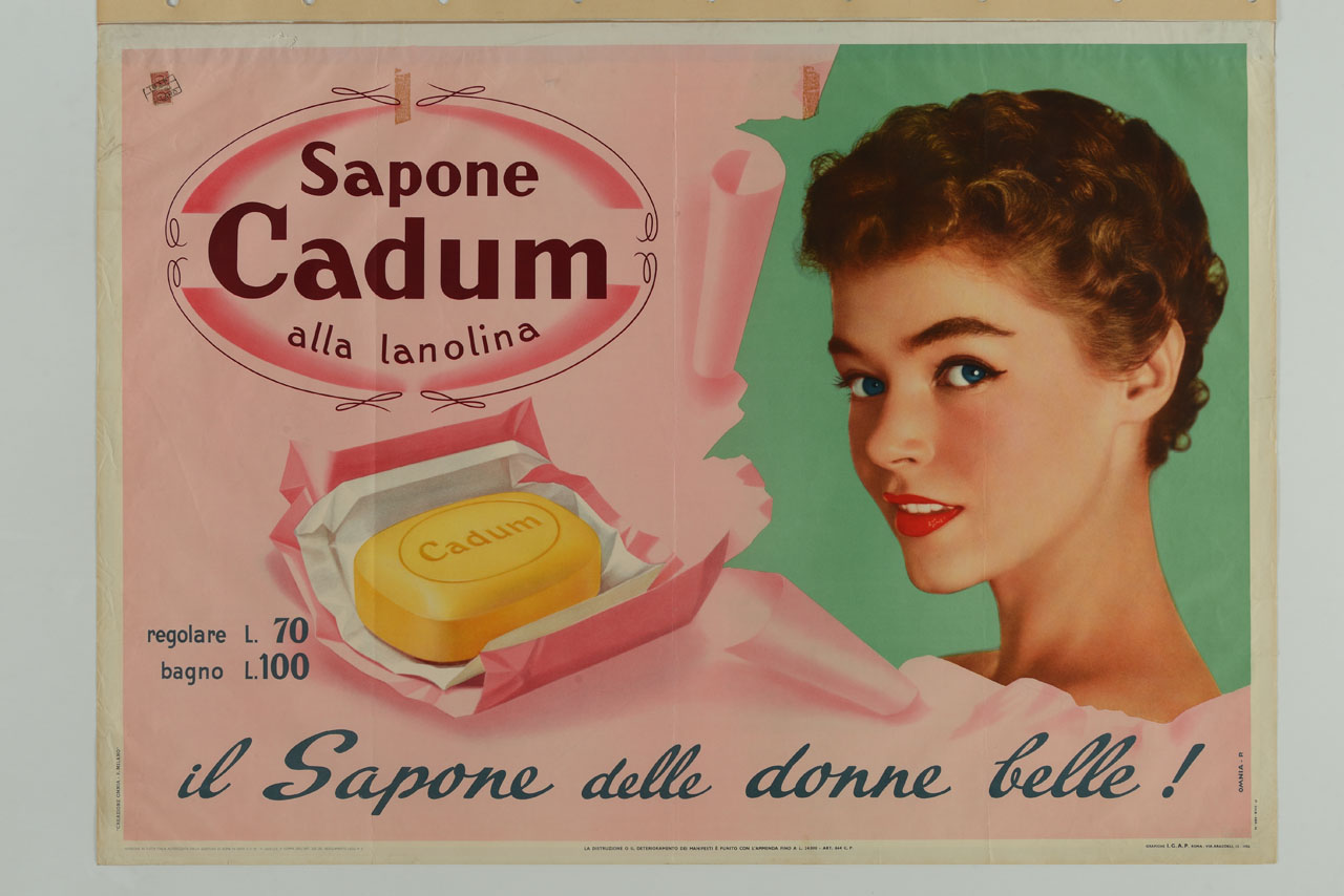 volto di donna dietro un manifesto squarciato e saponetta (manifesto) di Omnia Pubblicità (sec. XX)