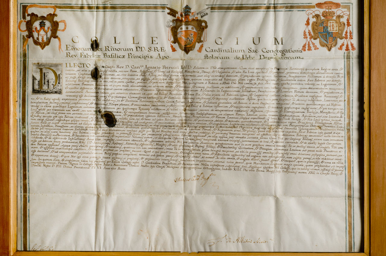 Nomina del Canonico Ignazio Petrucci come Commissario alle opere, Revisore dei conti e Giudice generale della Reverenda Fabbrica di San Pietro nel territorio del Patrimonio, Pergamena miniata con edifici antichi nel capolettera (miniatura) - ambito romano (fine sec. XVIII)