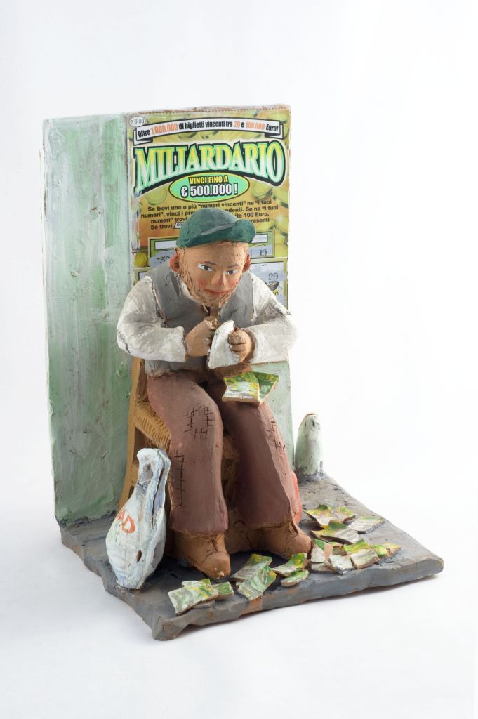 Il milionario, uomo che gratta una tessera (fischietto, a fessura interna, strumenti musicali) di Lombardo Giuseppe - laboratorio (2007)