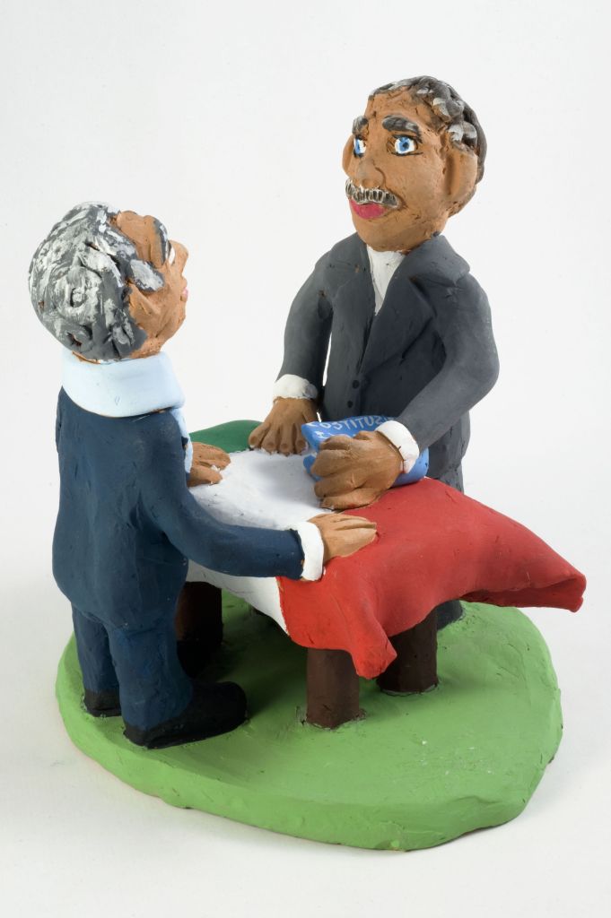 Tutti per una, una costituzione per tutti, due uomini intorno un tavolo e bandiera italiana (fischietto, a fessura interna, strumenti musicali) di Montedoro C, Valanzano V - scuola, scuola (2010, 2010)