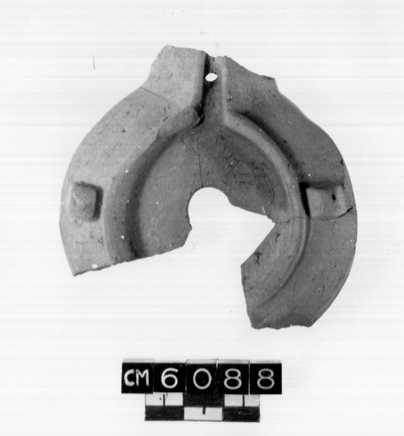 lucerna, Menzel X, disco, spalla (I-II secc. d.C)