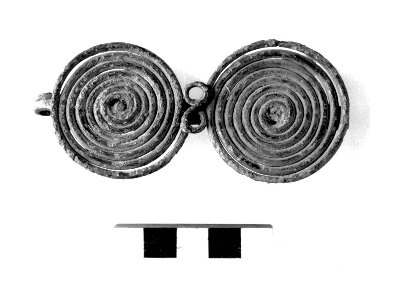 fibula ad occhiali, Sundwall, tipo E I ad - fase Piceno II (sec. VIII a.C)