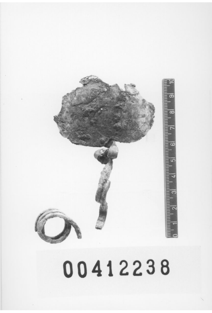 fibula ad arco serpeggiante/frammento (X sec. a.C)