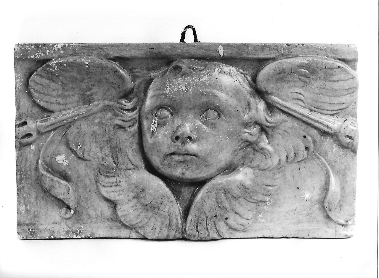 testa d'angelo (calco, serie) - produzione coreglina (sec. XX)