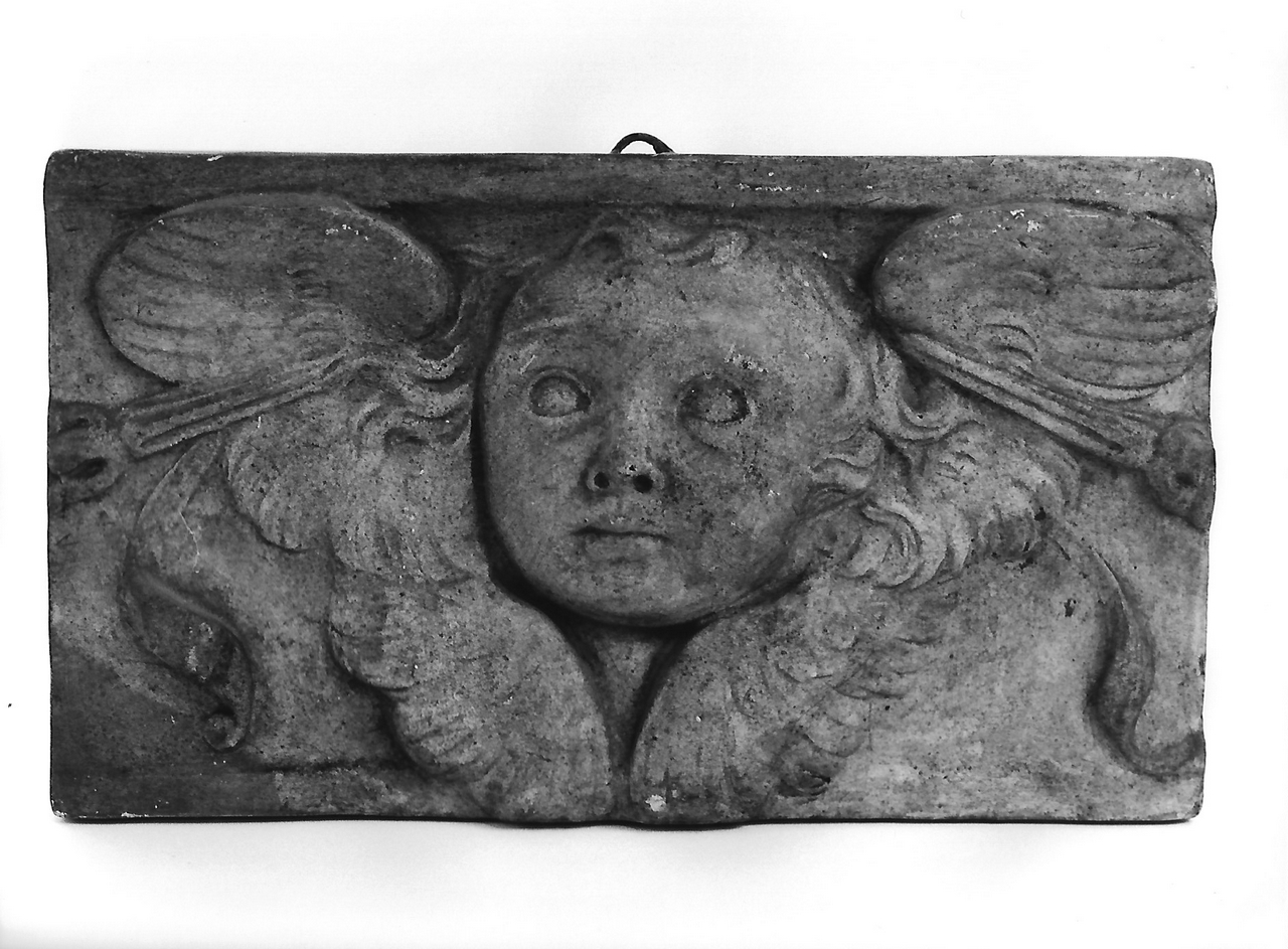 testa d'angelo (calco, serie) - produzione coreglina (fine/ inizio secc. XIX/ XX)