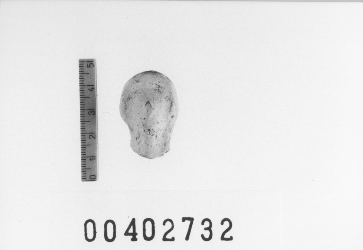 Figura femminile (Testa di statuetta, Comella, gruppo C I a 10) (III a.C, II a.C, I a.C)