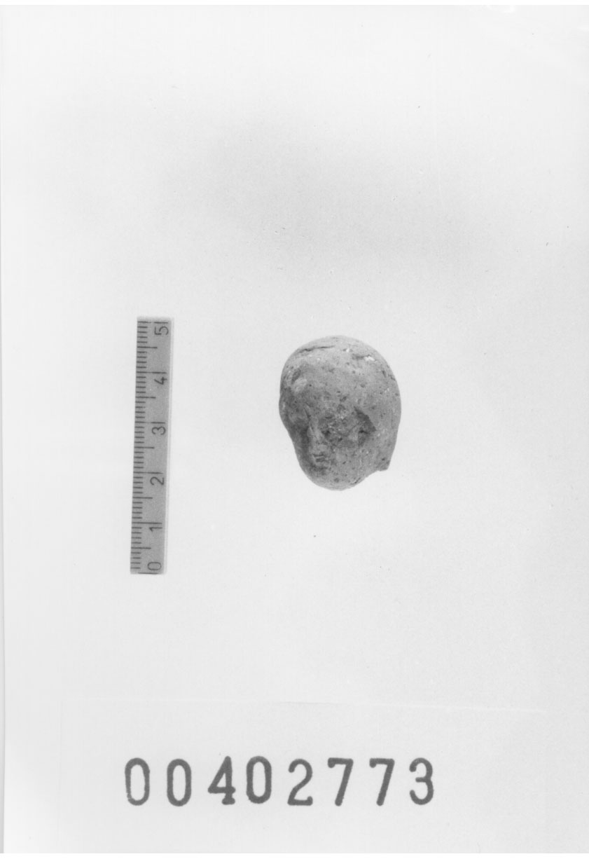 Figura umana (femminile ?) (Testa di statuetta, Comella, gruppo C I a 12) (III a.C, II a.C, I a.C)