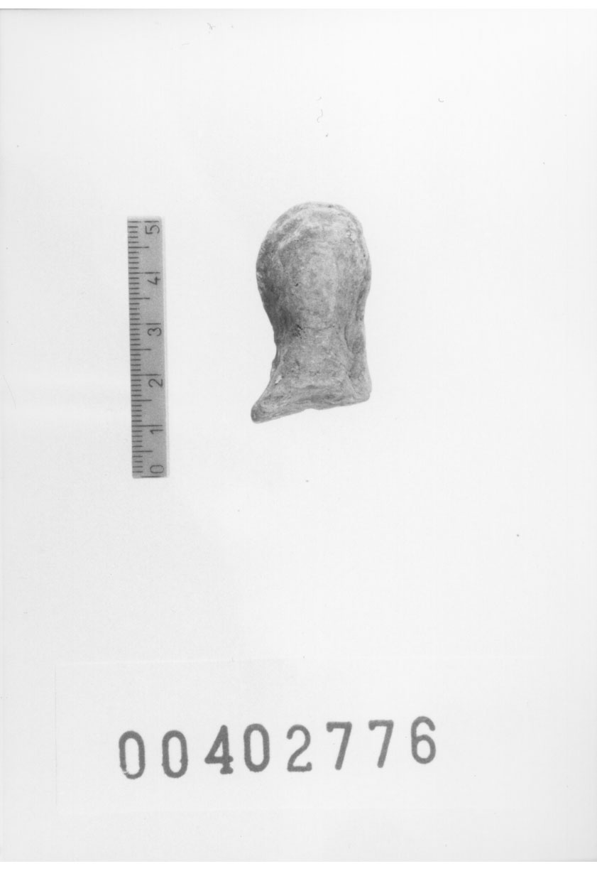 Figura femminile (Testa di statuetta, Comella, gruppo C I a 10) (III a.C, II a.C, I a.C)