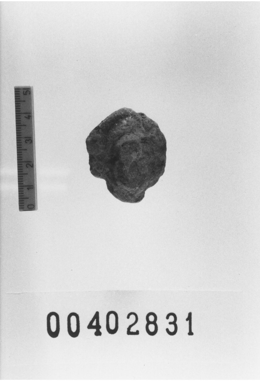 Figura femminile (Testa di statuetta, Comella, gruppo C I a 10) (III a.C, II a.C, I a.C)