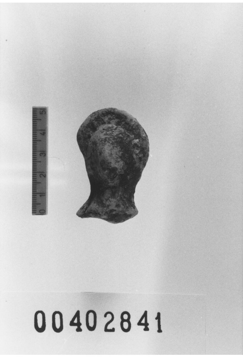 Figura femminile (Testa di statuetta, Comella, gruppo C I a 10) (III a.C, II a.C, I a.C)