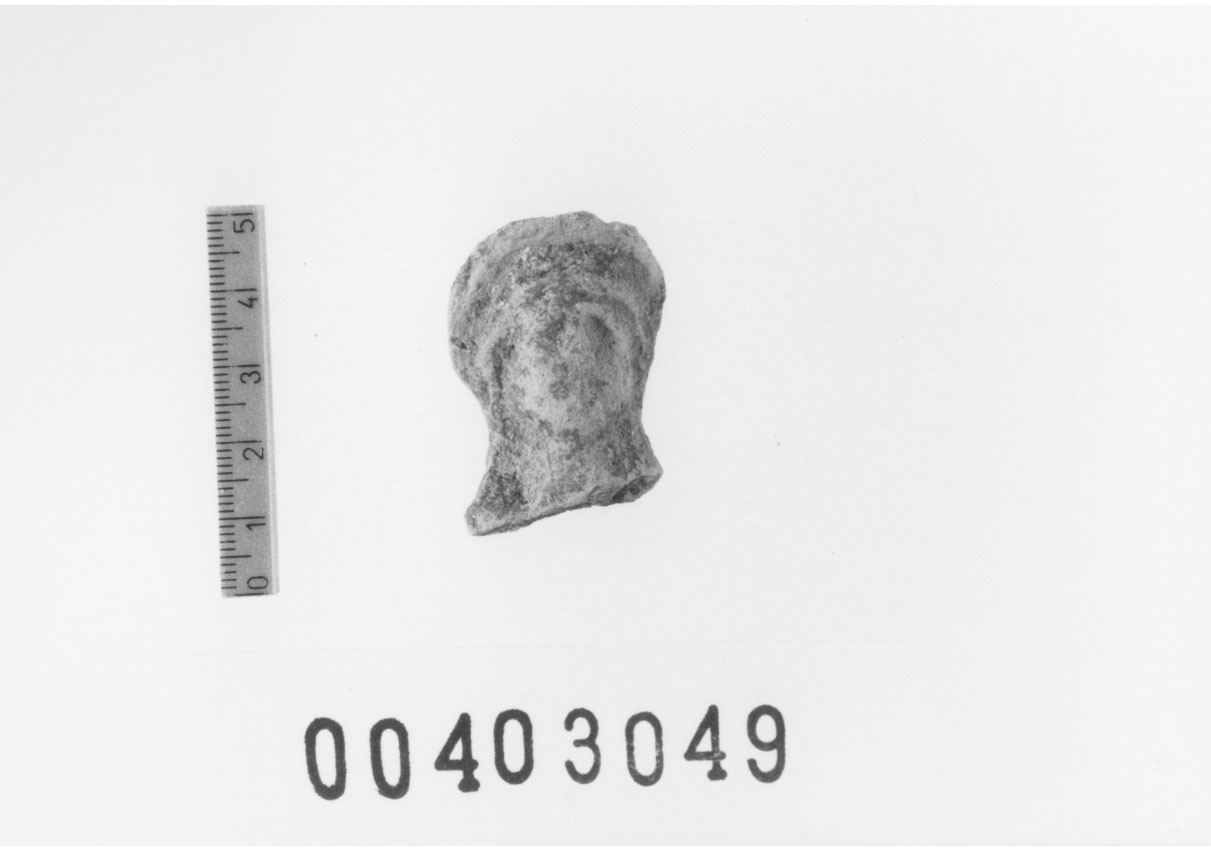 Figura femminile (Testa di statuetta, Comella, gruppo C I a 10) (III a.C, II a.C, I a.C)