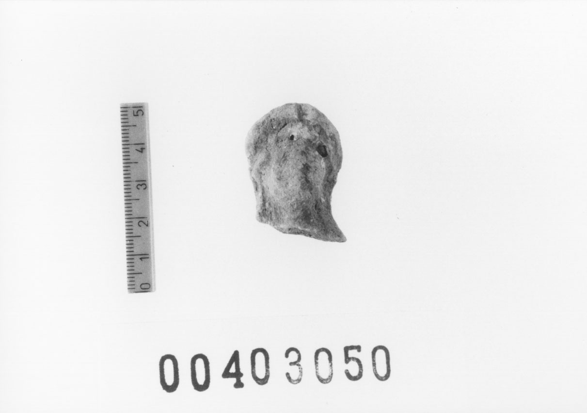 Figura femminile (Testa di statuetta, Comella, gruppo C I a 10) (III a.C, II a.C, I a.C)