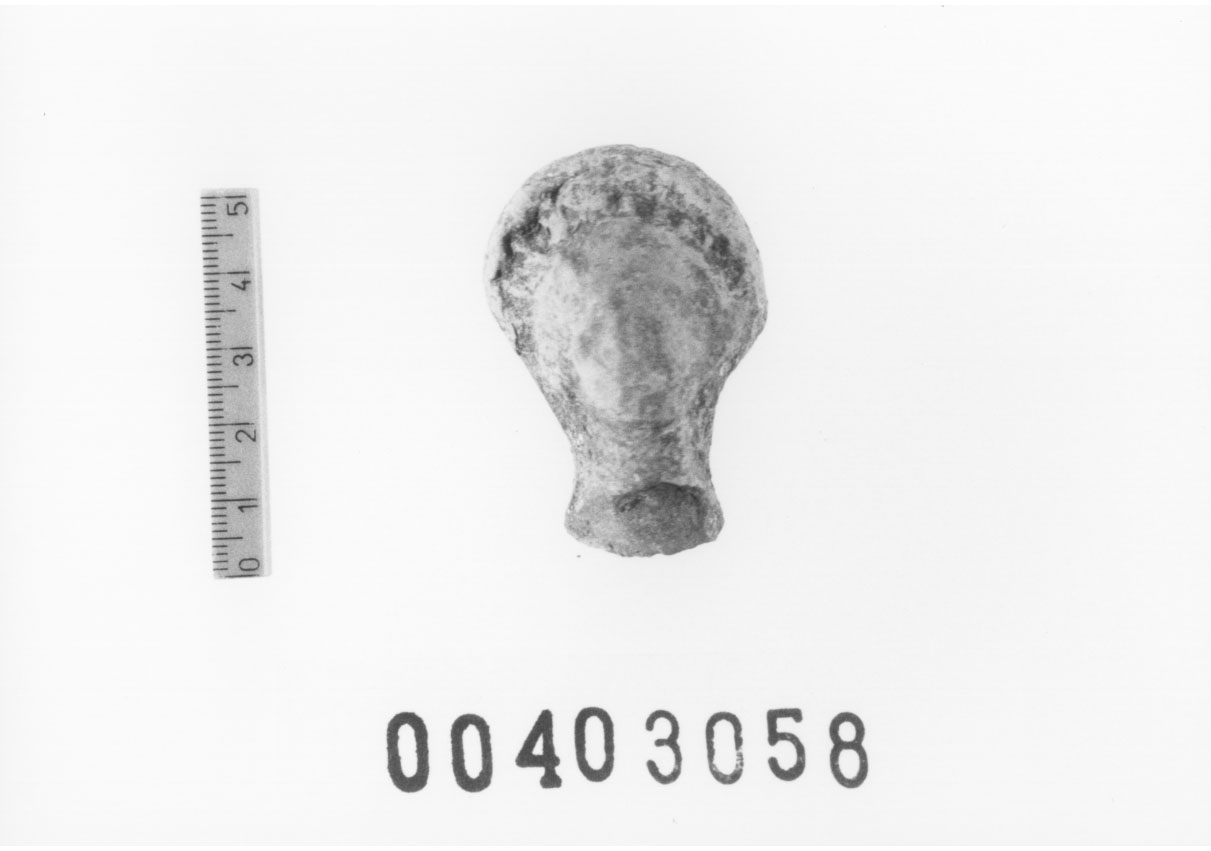 Figura femminile (Testa di statuetta, Comella, gruppo C I a 10) (III a.C, II a.C, I a.C)