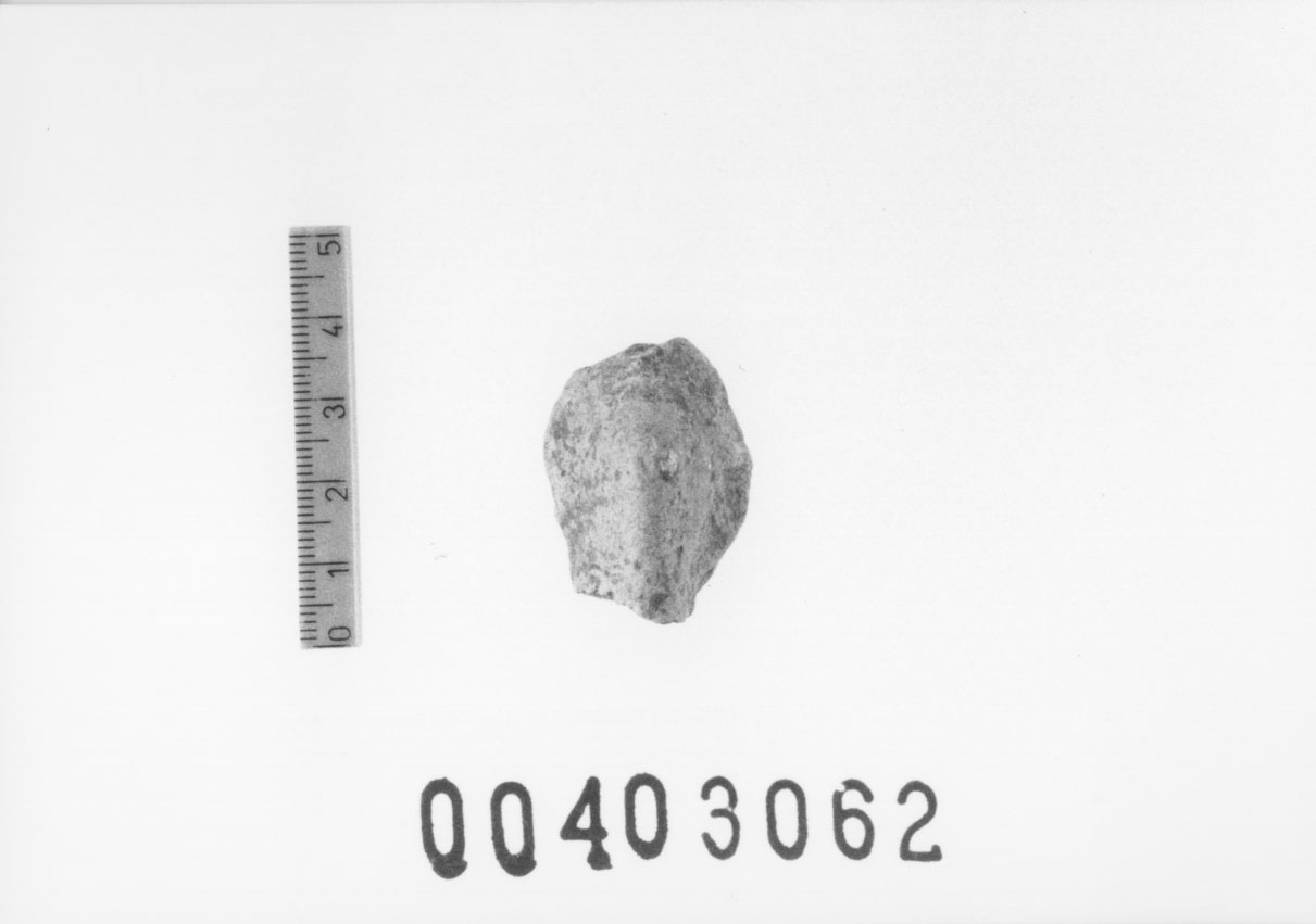 Figura femminile (Testa di statuetta, Comella, gruppo C I a 10) (III a.C, II a.C, I a.C)