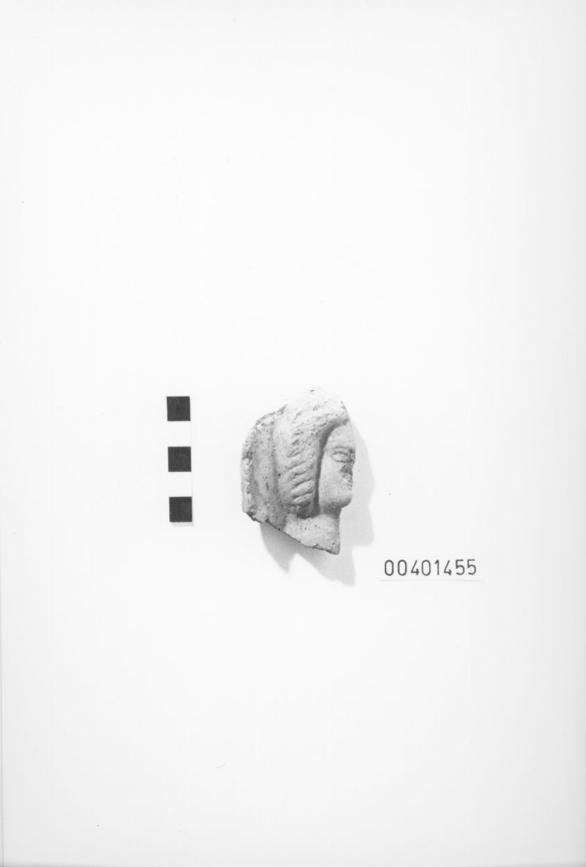 Mezza testa votiva/ frammento (IV a.C)