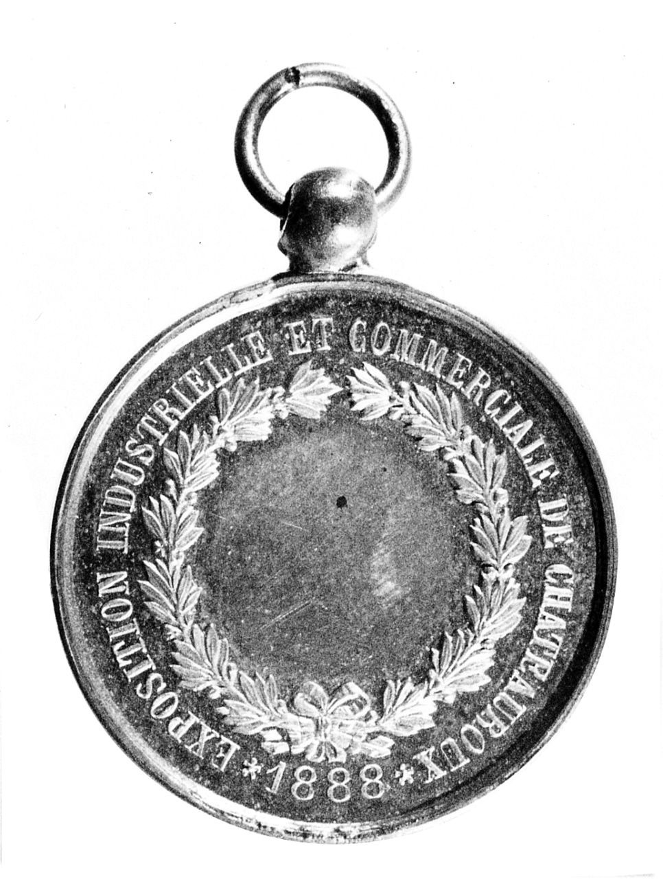 Medaglia a Torello Ancillotti per l'Exposition Industrielle et Commerciale de Chateauroux, (r.), ghirlanda con iscrizione (medaglia) - ambito italiano (sec. XIX)