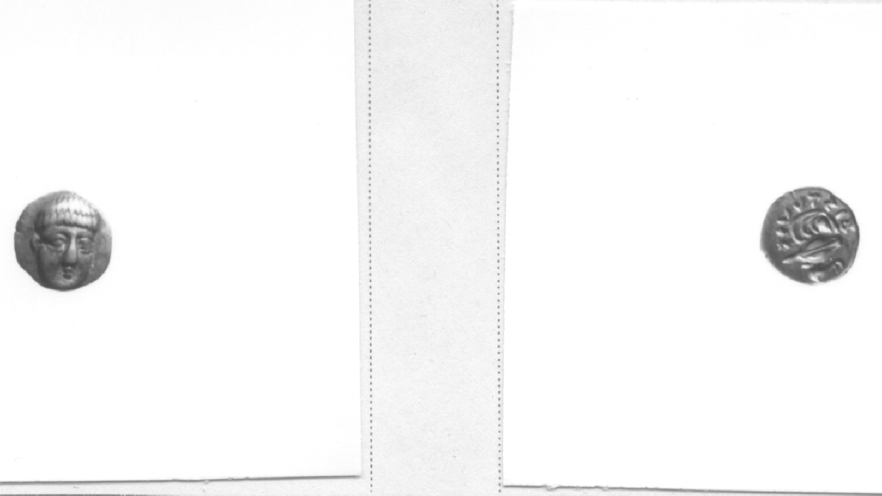 Testa frontale / cozza (moneta, obolo) (IV sec. a. C)