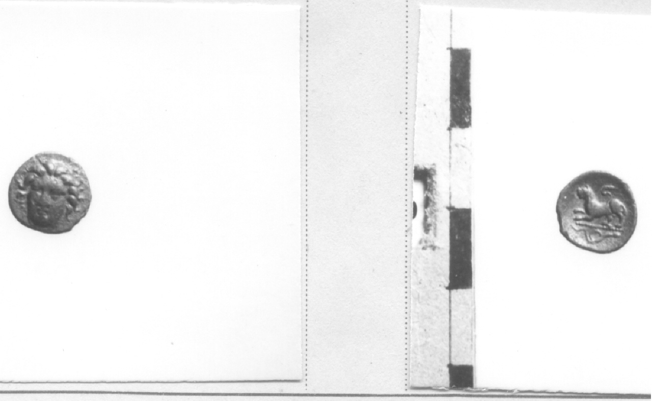 Testa di tre quarti / leone (moneta, obolo) (IV sec. a. C)