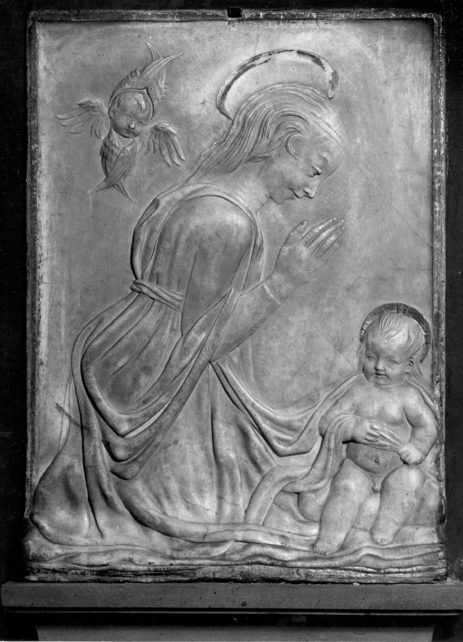 La Vergine genuflessa in adorazione del Bambino, Maria Vergine (rilievo) di Desiderio da Settignano (scuola) (sec. XV)