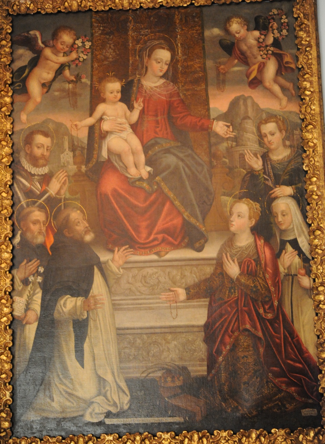Madonna del Rosario col Bambino e i santi Domenico, Vincenzo Ferrer, Costanzo da Brescia (?), Caterina d'Alessandria, Caterina da Siena e Barbara (dipinto, opera isolata) di Mombello Luca (sec. XVI)