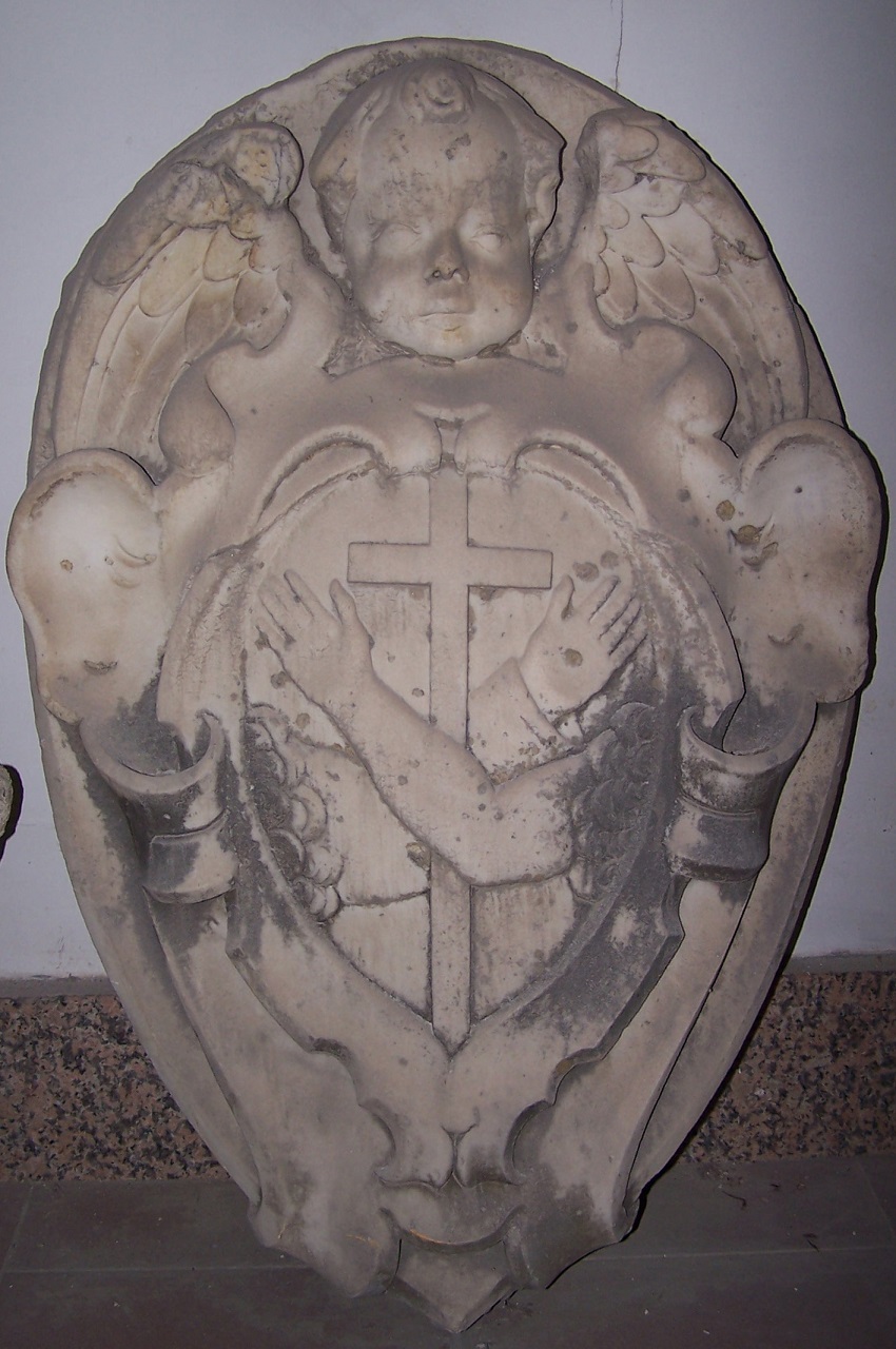 Scudo araldico figurato, sormontato da puttino alato e attorniato da volute (stemma religioso) - bottega messinese (XVIII)