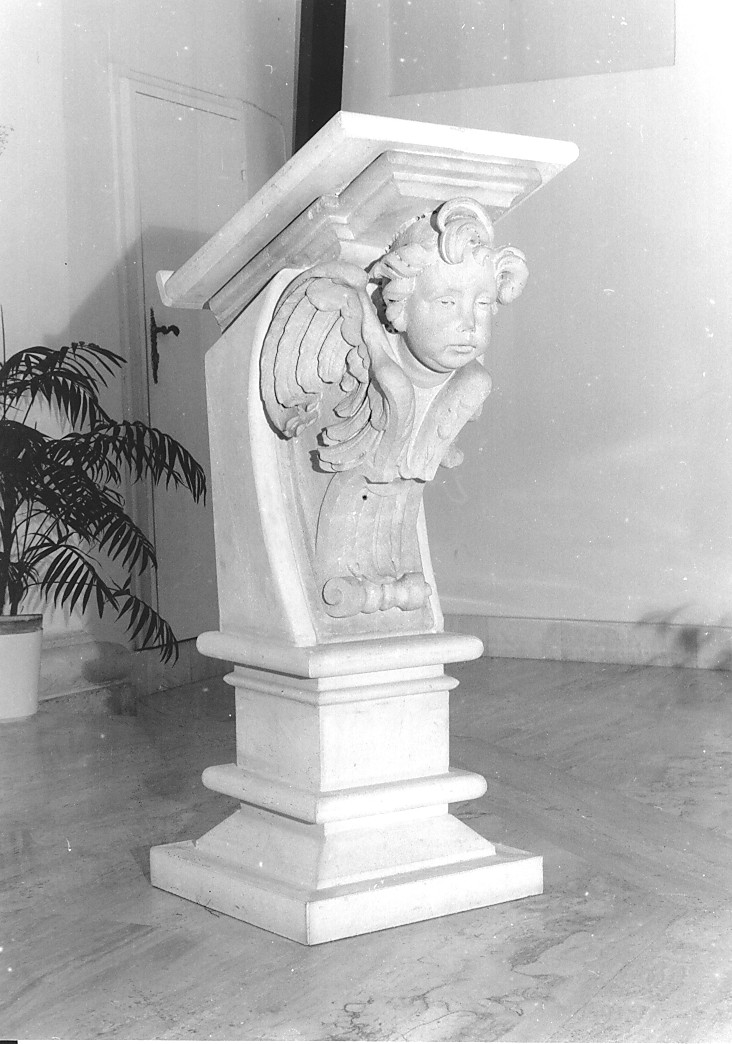 motivo decorativo a voluta con testa di angelo (rilievo, opera isolata) - ambito abruzzese (sec. XVIII)