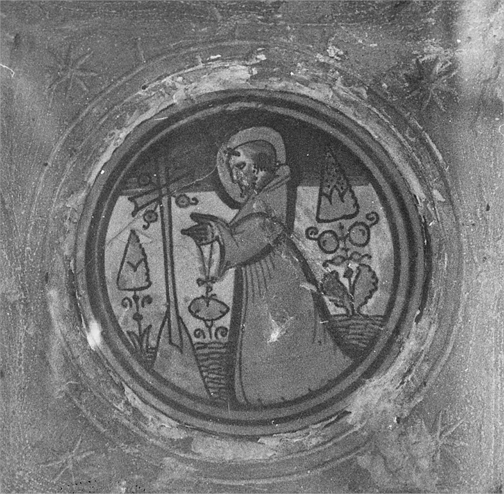 Santo frate, crocifisso, motivi decorativi vegetali e solari (medaglione) - manifattura del Castelli (sec. XIX)