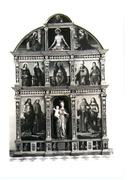 Eterno, Cristo in Pietà, Annunciazione, SS. Caterina d'Alessandria e Bonaventura, San Pietro, SS. Ludovico da Tolosa e Chiara, SS. Giovanni Evangelista e Antonio, SS. Bernardino e Pietro Martire fra i quattro martiri del Marocco (polittico) di Luce Giovanni (sec. XVI)