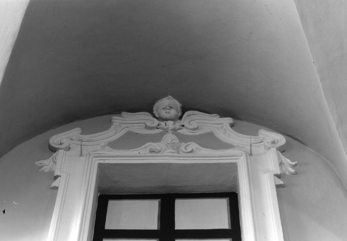 motivi decorativi a volute e teste di putto (mostra di finestra, serie) - ambito romagnolo (seconda metà sec. XVIII)