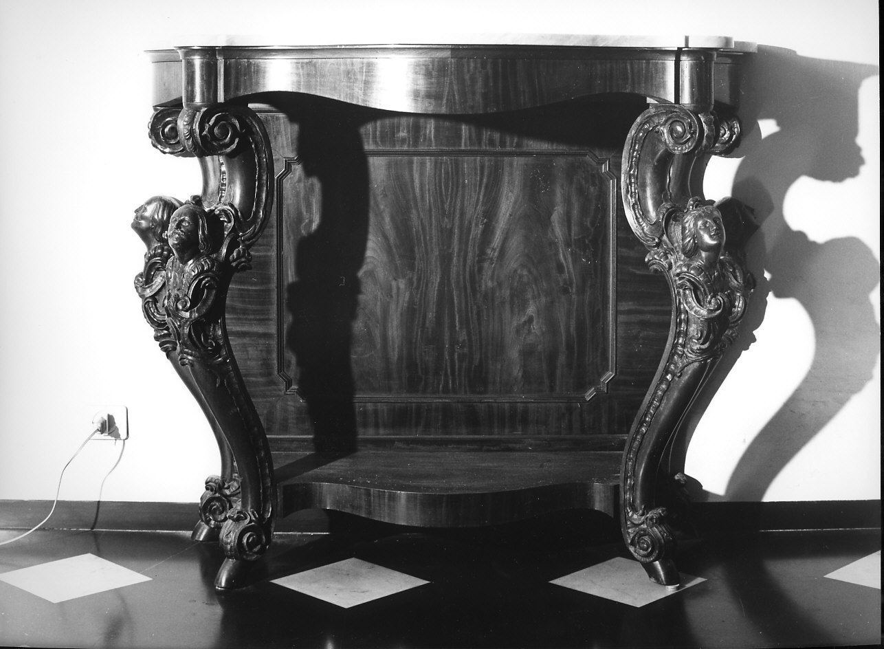 testa di donna/ testa d'uomo/ motivi decorativi a volute (console, opera isolata) - ambito italiano (metà sec. XIX)