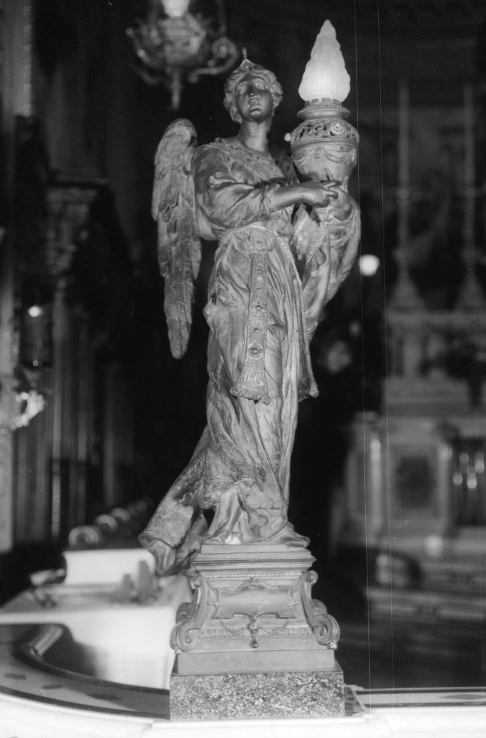 ANGELO DEL POPOLO BUSSANESE, angelo (lampada, opera isolata) di Pogliaghi Lodovico (primo quarto sec. XX)