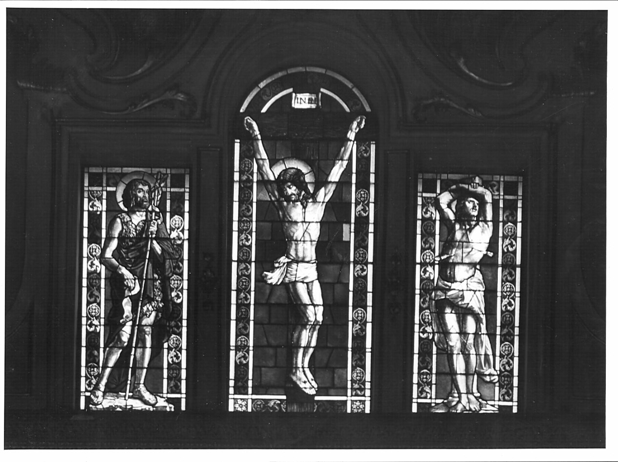 San Giovanni Battista; Cristo crocifisso; San Sebastiano (vetrata, opera isolata) - bottega lombarda (fine/inizio secc. XIX/ XX)