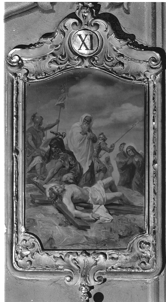 stazione XI: Gesù inchiodato alla croce (Via Crucis) di Morgari Luigi (sec. XX)