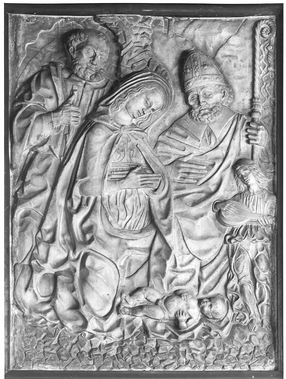 natività di Gesù con S. Ambrogio (rilievo, opera isolata) di Cazzaniga Tommaso (maniera) (fine sec. XV)