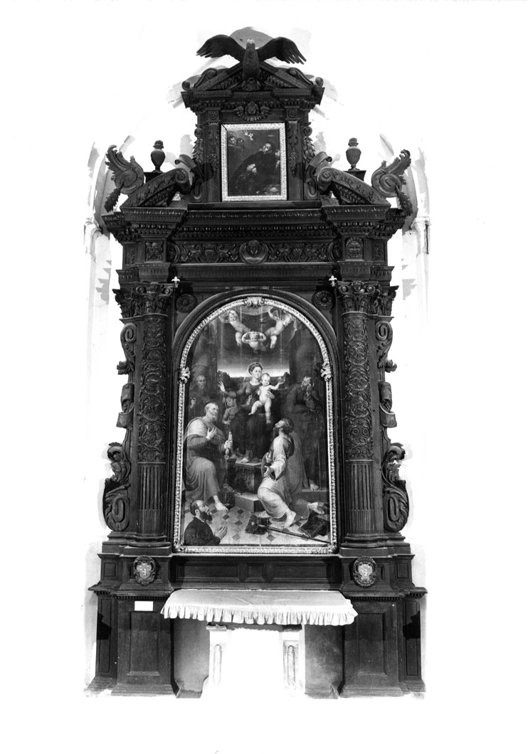 Madonna con Bambino in trono tra San Pietro, San Paolo, San Giuseppe, San Giovanni Battista, Sant'Antonio Abate e il donatore (dipinto) di Raffaellino del Colle (sec. XVI)