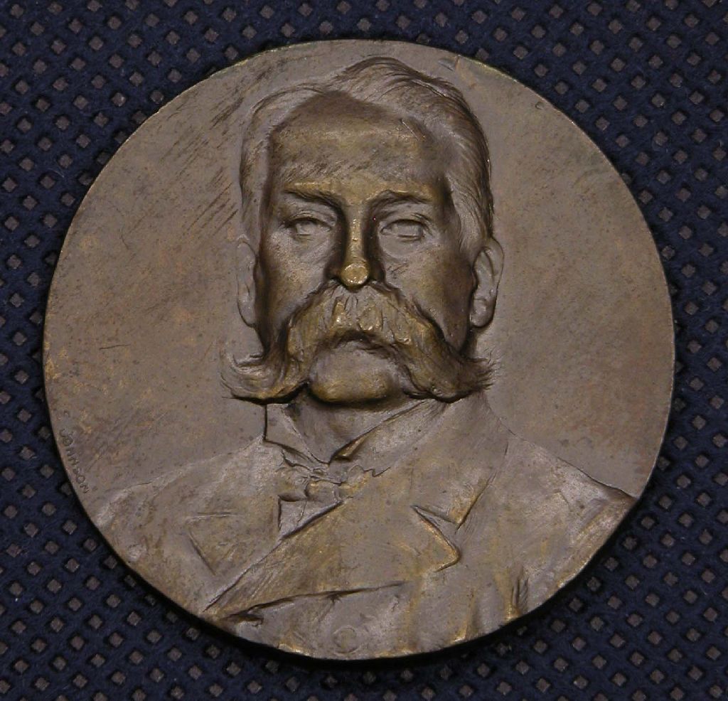 Diritto: Busto di Girolamo Caruso; Rovescio: iscrizione (medaglia, opera isolata) di Johnson Stefano (sec. XX)