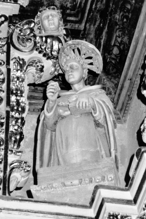 stemma vescovile di Mons. Orsi/ Allegoria della Fede Cristiana/ Allegoria della Fede Ebraica/ San Francesco d'Assisi (?)/ Santo vescovo (Mons. O rs i ?)/ Gloria del SS. Sacramento (portale) - produzione salentina (sec. XVIII)