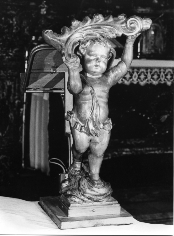 Putto sorreggente una palma (rilievo) - ambito romano (metà sec. XVIII)