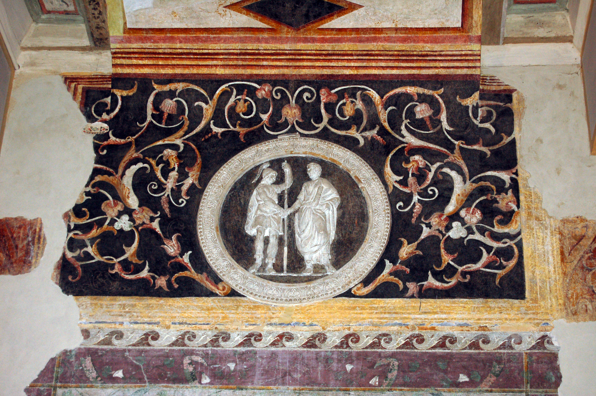 due personaggi che si stringono la mano (guerriero e togato) (decorazione plastico-pittorica, elemento d'insieme) di Pippi Giulio detto Giulio Romano (bottega) (sec. XVI)